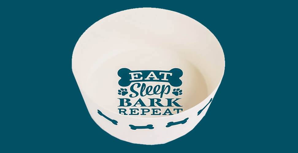 Cream dog bowl with blue bones and “Eat Sleep Bark Repeat” slogan – fun pet gift idea