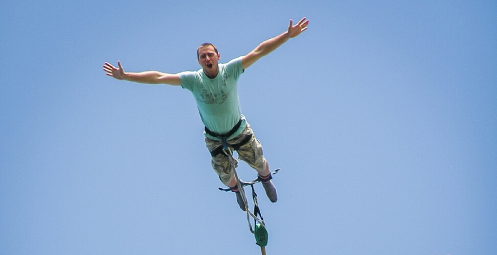 Man bungee jumping experience &ndash; extreme adventure activity for thrill seekers, heart-pumping outdoor adrenaline