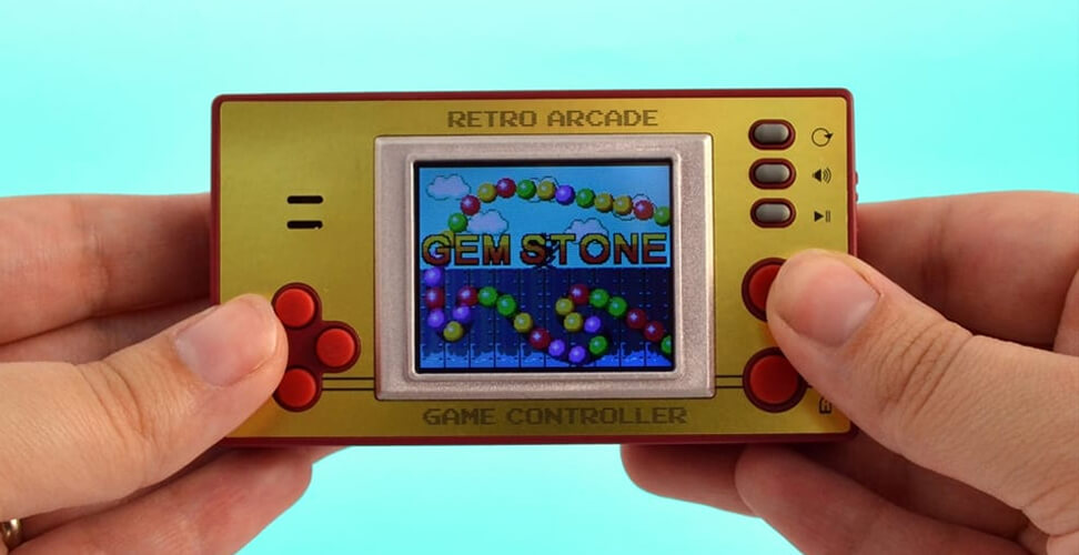 Person holding retro arcade handheld gaming console for nostalgic video games and classic Christmas gift idea