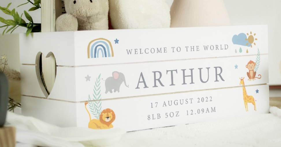 Personalized white baby keepsake box with birth details, animal illustrations, and a heart cut-out.