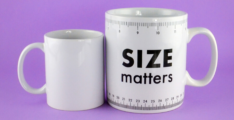 Size Matters giant coffee mug novelty gift shown beside standard mug &ndash; funny oversized cup for tea or coffee lovers