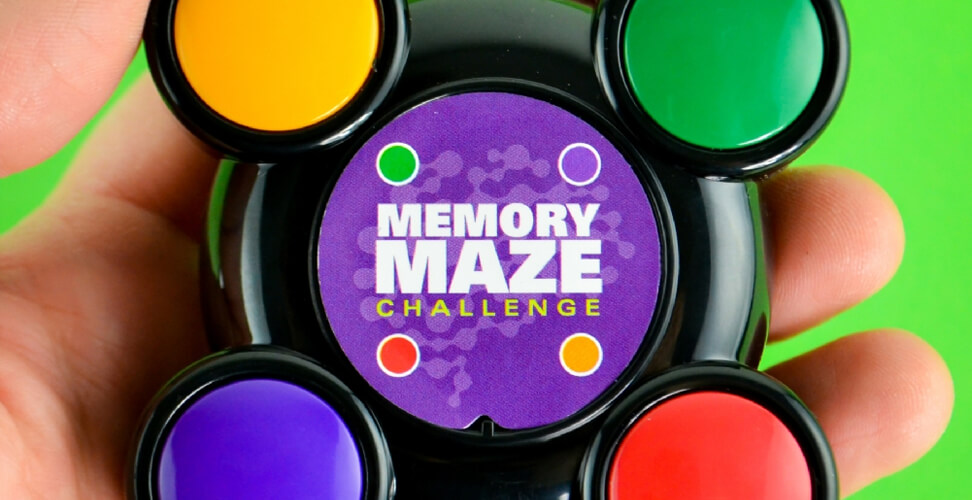 Hand holding Memory Maze Challenge game &ndash; fun brain teaser to remember light sequences, perfect novelty gift