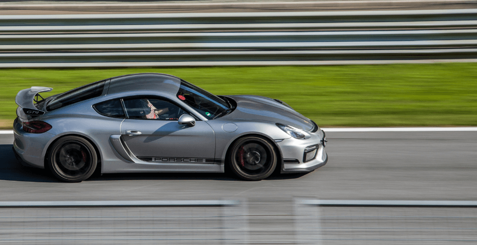 A silver sports car on a track