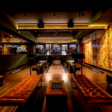 Boutique Bowling for Four at Play At Pins (1 games + Drink)