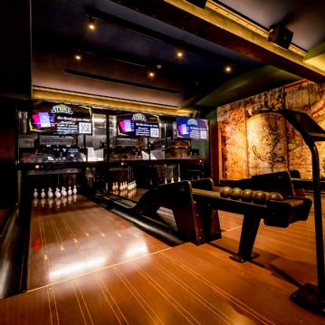 Boutique Bowling for Four at Play At Pins (1 games + Drink)