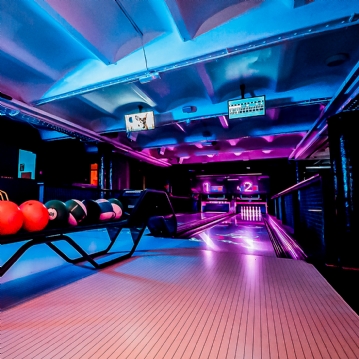 Boutique Bowling for Four at Play At Pins (1 games + Drink)