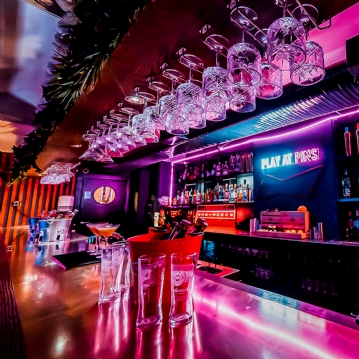 Boutique Bowling for Four at Play At Pins (1 games + Drink)