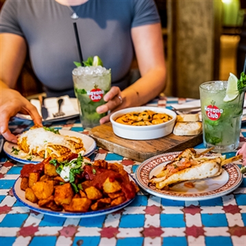 Bottomless Mojitos or Cruz Campo with 5 Plates