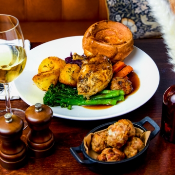 Traditional Sunday Roast with a Glass of Wine for Two