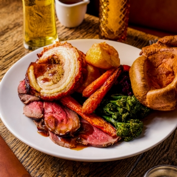 Traditional Sunday Roast with a Glass of Wine for Two