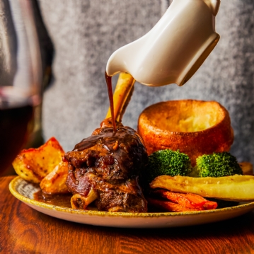 Traditional Sunday Roast with a Glass of Wine for Two