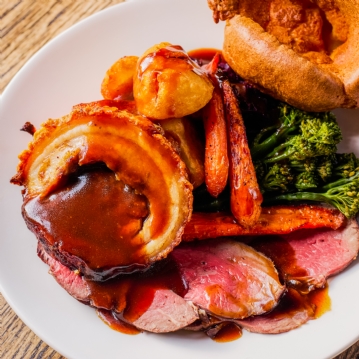 Traditional Sunday Roast with a Glass of Wine for Two