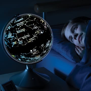 Illuminated Globe With Earth and Star Constellations
