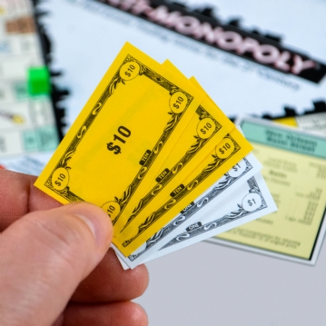 Anti-Monopoly Board Game Tin 