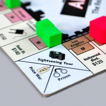 Anti-Monopoly Board Game Tin 