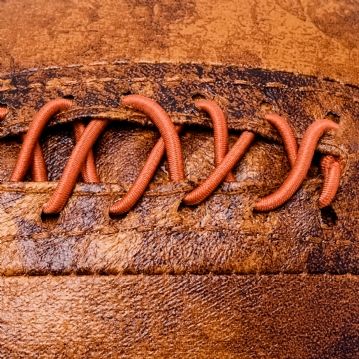 Distressed Faux Leather Football Doorstop